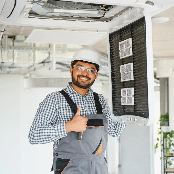 HVAC technician fixing the ventilation system