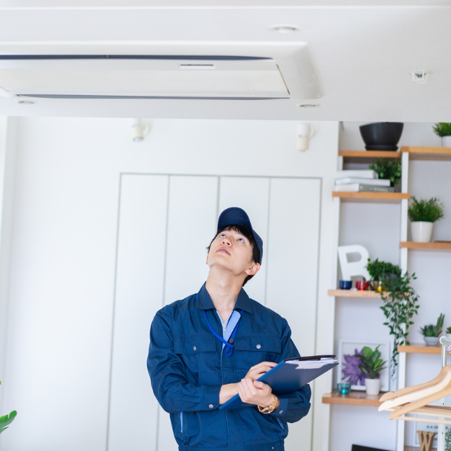 Technician performing preventive HVAC maintenance checklist