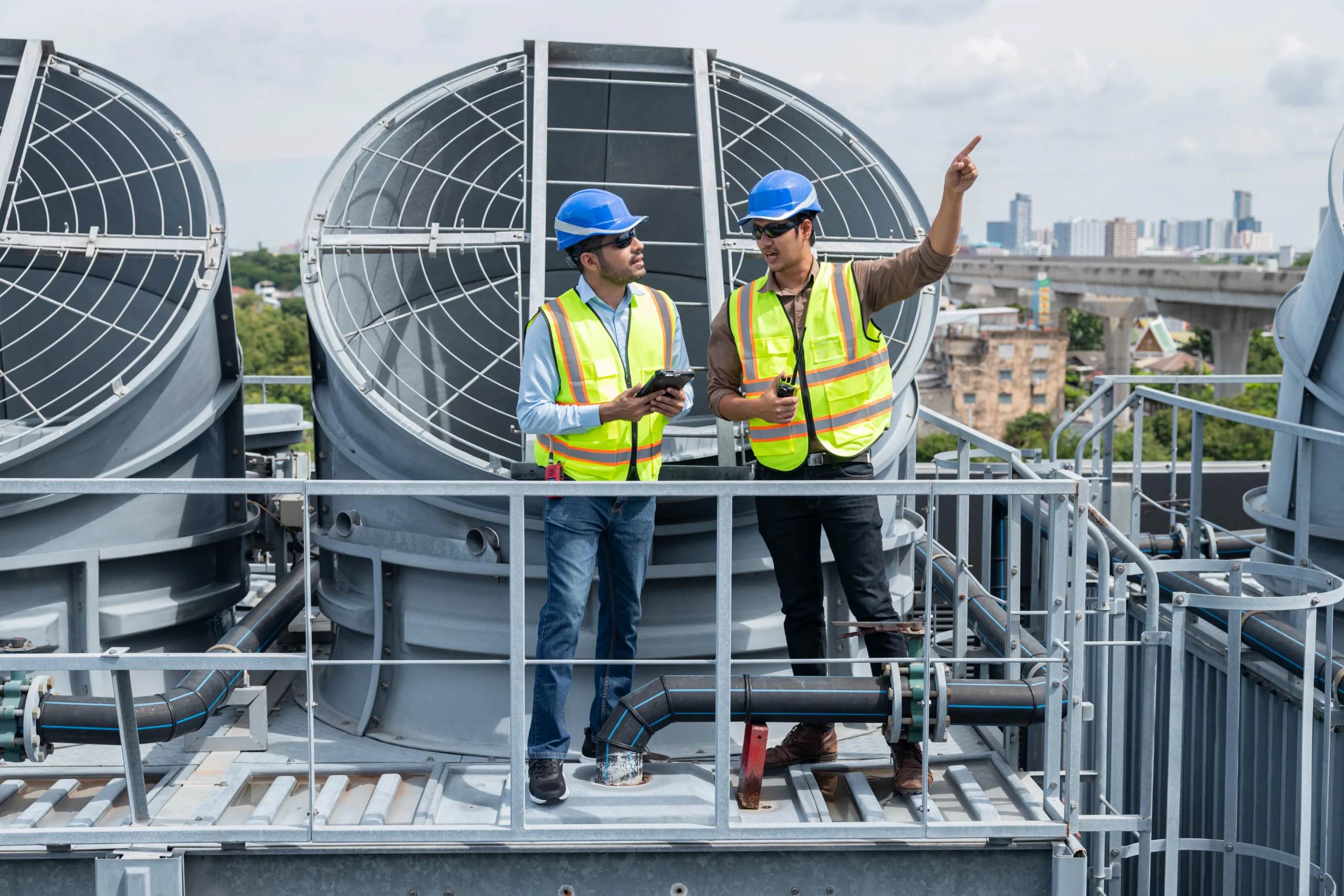 engineers-inspecting-rooftop-ventilation-system