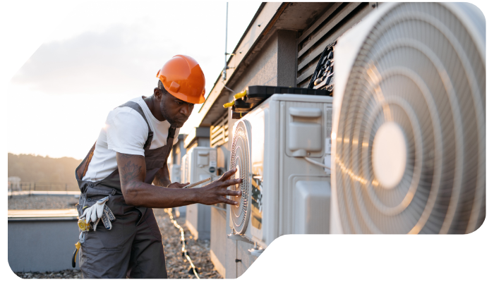 male-holding-tablet-and-installing-cooling-system