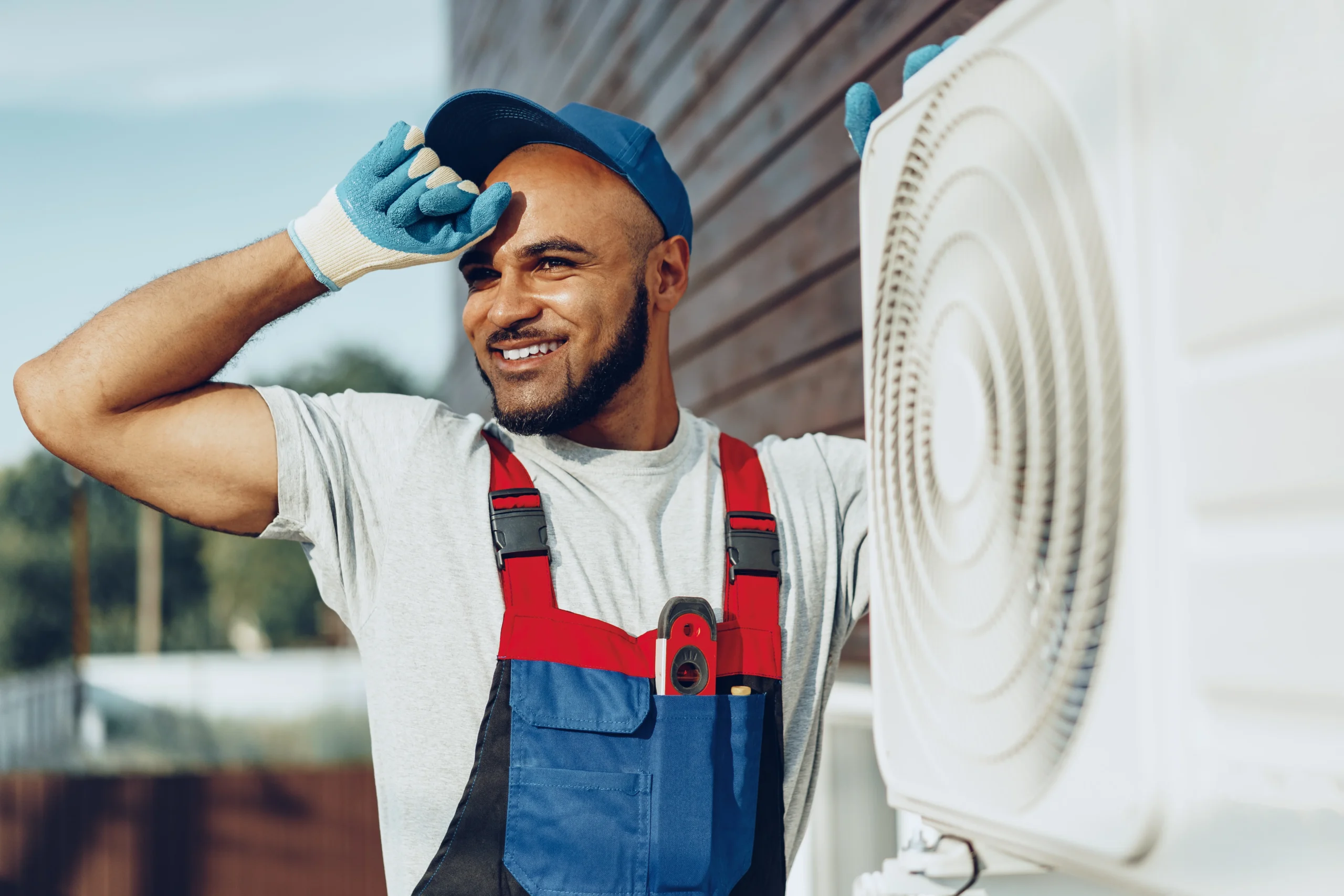 Repairman checking an AC unit